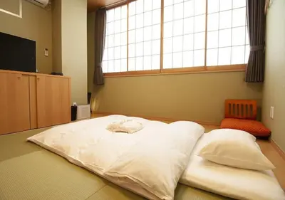 a large white bed in a room with a window at Arakawa-ku - Hotel / Vacation STAY 21946 in Tokyo