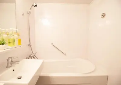 a white bathroom with a sink and a bath tub at Arakawa-ku - Hotel / Vacation STAY 21946 in Tokyo