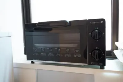 a microwave oven sitting on top of a counter at Roppongi ClassyHouse902 in Tokyo