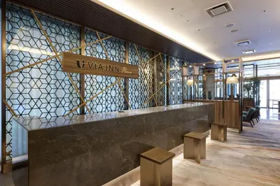 a lobby with a bar with a sign that reads viva infinity at Via Inn Prime Nihonbashi Ningyocho in Tokyo