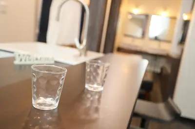 two glasses sitting on top of a table at Villa Ikebukuro in Tokyo