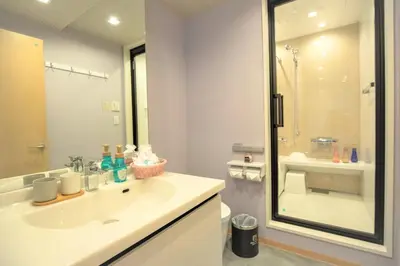 a bathroom with a sink and a shower at SOLA HOTEL in Tokyo