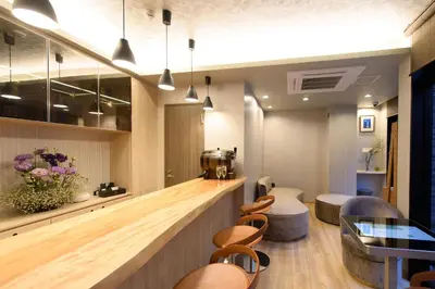 a salon with a bar with chairs and a counter at SOLA HOTEL in Tokyo