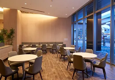 a conference room with tables and chairs and windows at Hotel JAL City Tokyo Toyosu in Tokyo