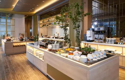 a buffet line in a restaurant with food on display at Hotel JAL City Tokyo Toyosu in Tokyo