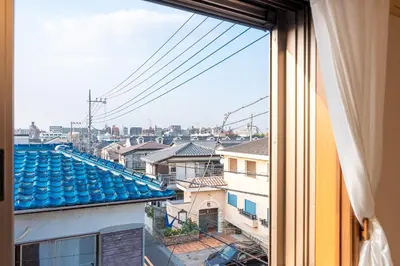 a view of a city from a window at Hong house in Tokyo