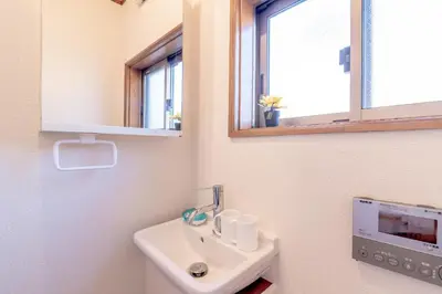 a bathroom with a sink and a mirror at Hong house in Tokyo