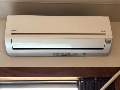 a white printer sitting on top of a counter at Nomad Hostel East in Tokyo
