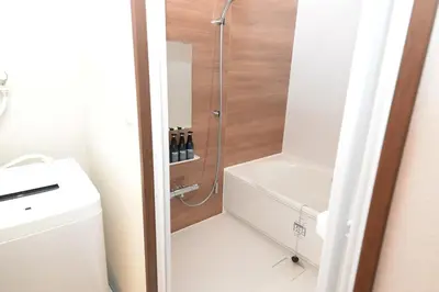 a bathroom with a shower and a toilet and a sink at ACT one in Tokyo