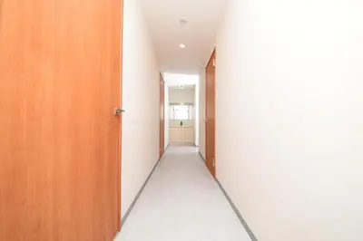 a corridor of an empty room with a hallway at ACT one in Tokyo