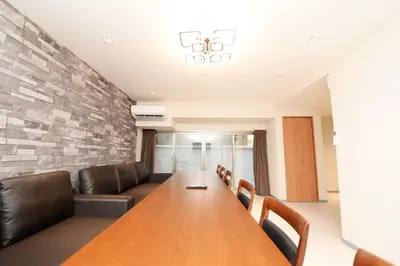 a conference room with a long table and leather chairs at ACT one in Tokyo