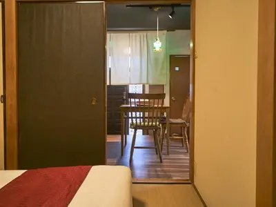a view of a room with a dining room table at Kagurazaka Retro BAR & HOTEL in Tokyo