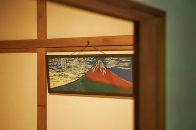 a painting of a mountain on a door at Kagurazaka Retro BAR & HOTEL in Tokyo