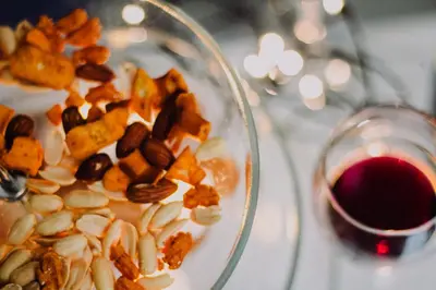 a bowl of nuts and a glass of red wine at Alo BnB 4 - Near KABUKICHO, SHINJUKU, SHINOKUBO, SHIBUYA - Self check-in in Tokyo