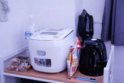 a coffee maker sitting on a shelf in a refrigerator at Alo BnB 4 - Near KABUKICHO, SHINJUKU, SHINOKUBO, SHIBUYA - Self check-in in Tokyo