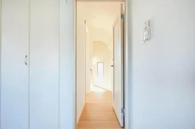a hallway with a white door leading into a room at koiwa house 3LDK free wifi free parking in Tokyo