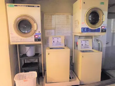 a laundry room with two washes and two machines at ☆Cozy Japanese style room☆ in Tokyo