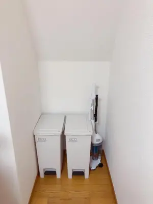 a small bathroom with two trash cans and a toilet at C.H.House in Tokyo