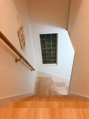 a stairway with a window and a stair case at C.H.House in Tokyo