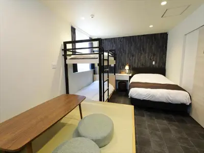 a bedroom with a bed and a bunk bed at CHA-AN HOTEL UENO in Tokyo