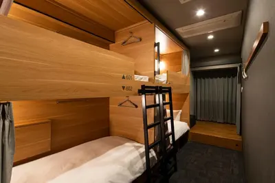 a bunk bed room with two beds and a ladder at Grids Tokyo Ueno Hotel&Hostel in Tokyo