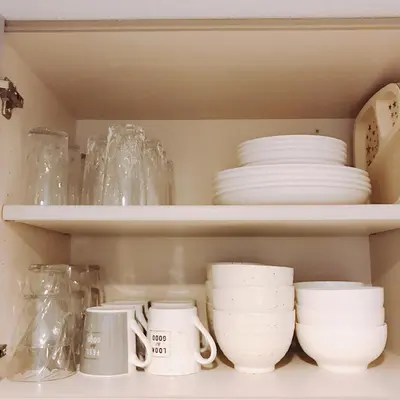a shelf with dishes and other dishes on it at nestay house tokyo itabashi 01 in Tokyo