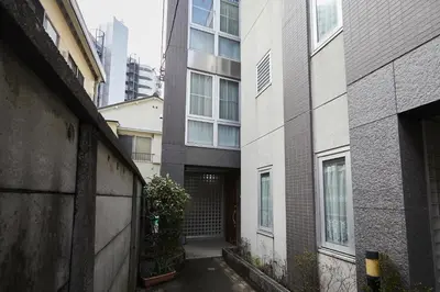 an alley between two buildings with a building at 22-Sweet Dreams House in JR Okubo Station 5 min in Tokyo