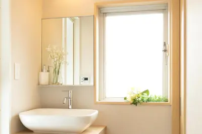 a bathroom with a sink and a mirror and a window at Sakura Stay Yoga 201 in Tokyo