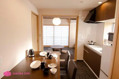 a kitchen and dining room with a table in a room at Sakura Stay Yoga 201 in Tokyo
