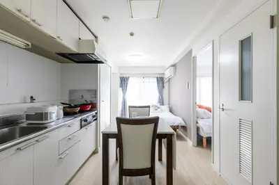 a kitchen with a table and a dining room at G-Shinkoiwa ColorBee Hostel4 4min to nearest station in Tokyo