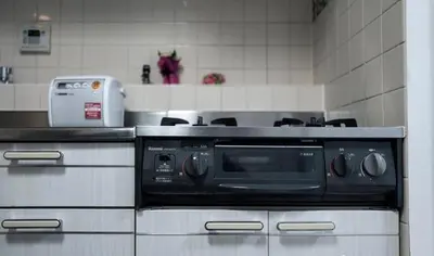 a microwave oven sitting in a kitchen at G-Shinkoiwa ColorBee Hostel4 4min to nearest station in Tokyo