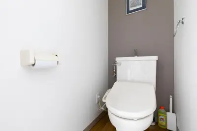 a bathroom with a toilet and a roll of toilet paper at G-Shinkoiwa ColorBee Hostel4 4min to nearest station in Tokyo