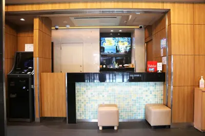 a restaurant with a bar with a tiled counter at Tabist TOKYO CITY VIEW HOTEL in Tokyo