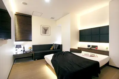 a hotel room with a bed and a couch at Hotel DUO kinsicho in Tokyo