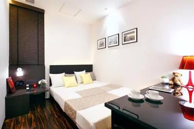 a bedroom with a large bed and a desk at Hotel DUO kinsicho in Tokyo