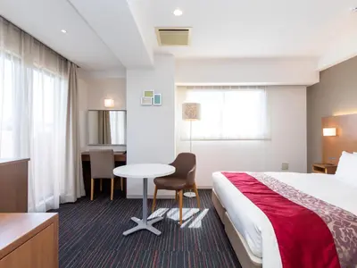 a hotel room with a bed and a desk and a table at Tokyu Stay Monzen-Nakacho Tokyo in Tokyo