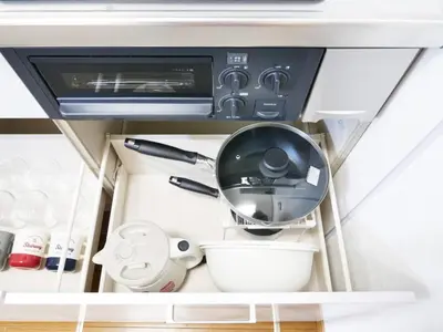 a kitchen drawer with a utensil and a bowl at Triphome Ikebukuro Tokyo Max 7ppls FREE WIFI in Tokyo