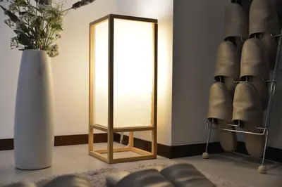 a dressing room with a mirror and a vase at K House in Tokyo