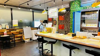 a restaurant with a counter and stools in a room at Hotel Adonis Tokyo - Dormitory Share Room For Male Only At City Center in Tokyo