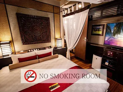 a no smoking room with a bed and a tv at Hotel Balian Resort Higashi Shinjuku in Tokyo
