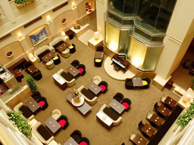 an overhead view of a hotel lobby with chairs and tables at Ginza Creston in Tokyo