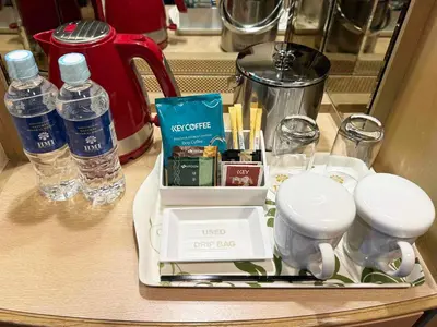 a tray with a coffee maker and drinks on a counter at Ginza Creston in Tokyo