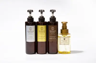 four bottles of essential oils on a white background at HOTEL AMANEK Kamata-Eki Mae in Tokyo