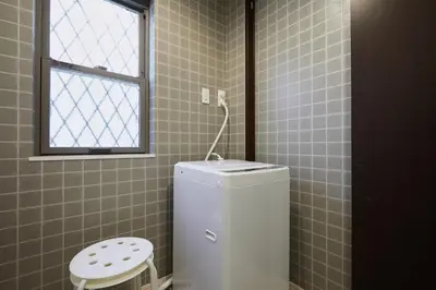 a small bathroom with a toilet and a window at P O IN T - 3BR Villa - Ikebukuro in Tokyo