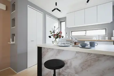 a kitchen with a marble counter and a stool at P O IN T - 3BR Villa - Ikebukuro in Tokyo