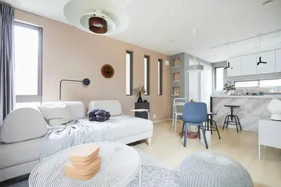 a living room with a white couch and a table at P O IN T - 3BR Villa - Ikebukuro in Tokyo