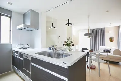 a kitchen with a sink and a living room at P O IN T - 3BR Villa - Ikebukuro in Tokyo