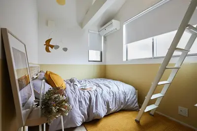 a bedroom with a bed and a ladder at P O IN T - 3BR Villa - Ikebukuro in Tokyo