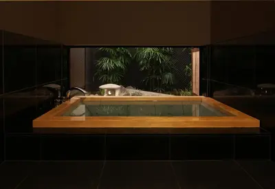 a bath tub in a bathroom with a window at The Edo Sakura in Tokyo
