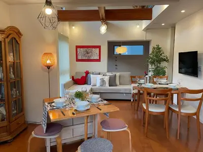 a living room with a table and a couch at Skytree House In Tokyo in Tokyo